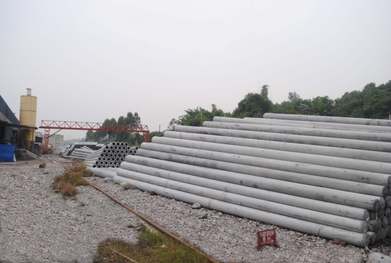 Spun concrete poles stacked in the Zhongdian yard